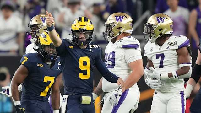 Michigan quarterback J.J. McCarthy points down the field during the second half of the College Football Playoff national championship game against Washington at NRG Stadium in Houston, Texas on Monday, Jan. 8, 2024.